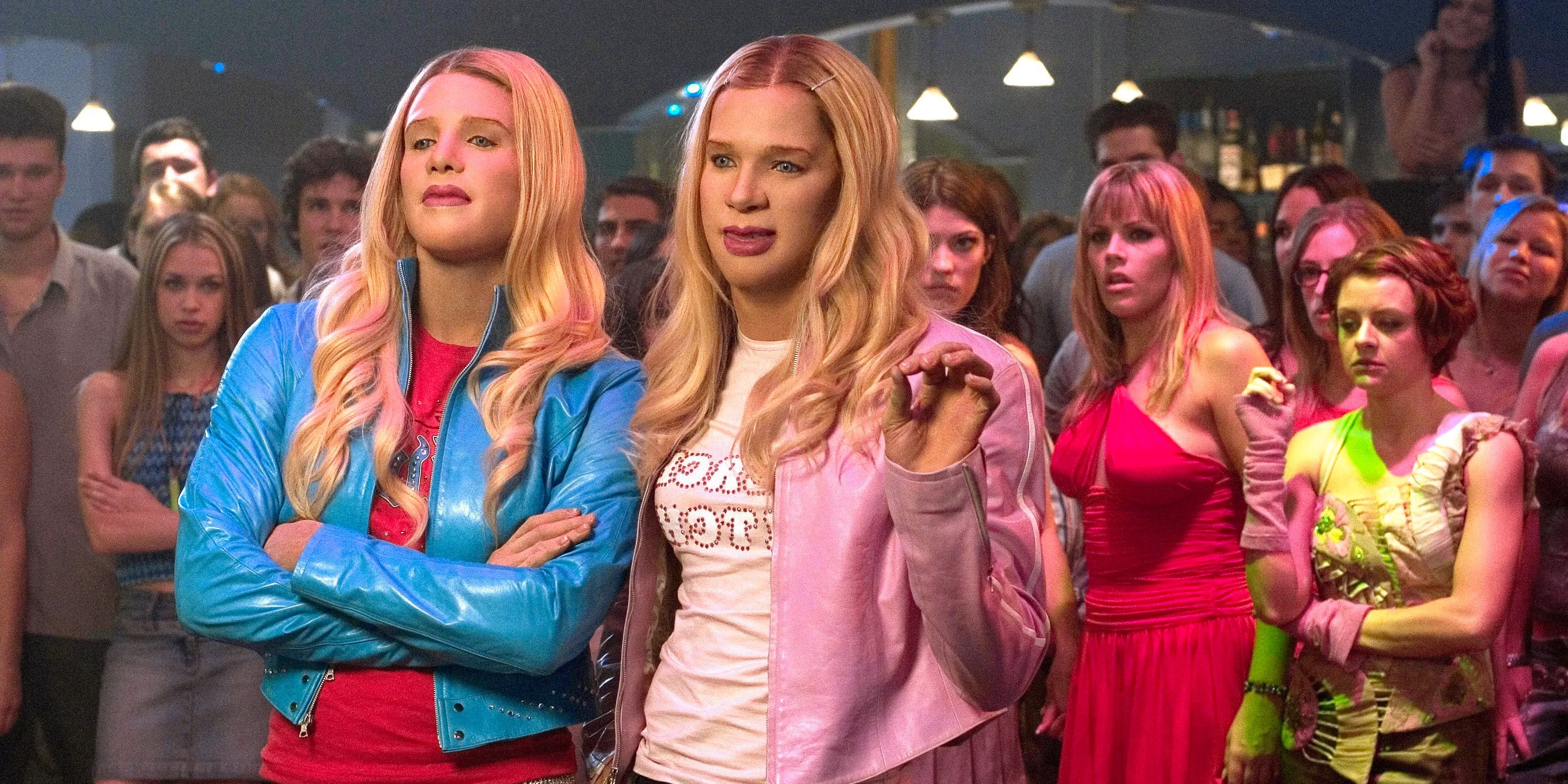 Marcus and Kevin stand in front of their friends in a club in White Chicks. Image