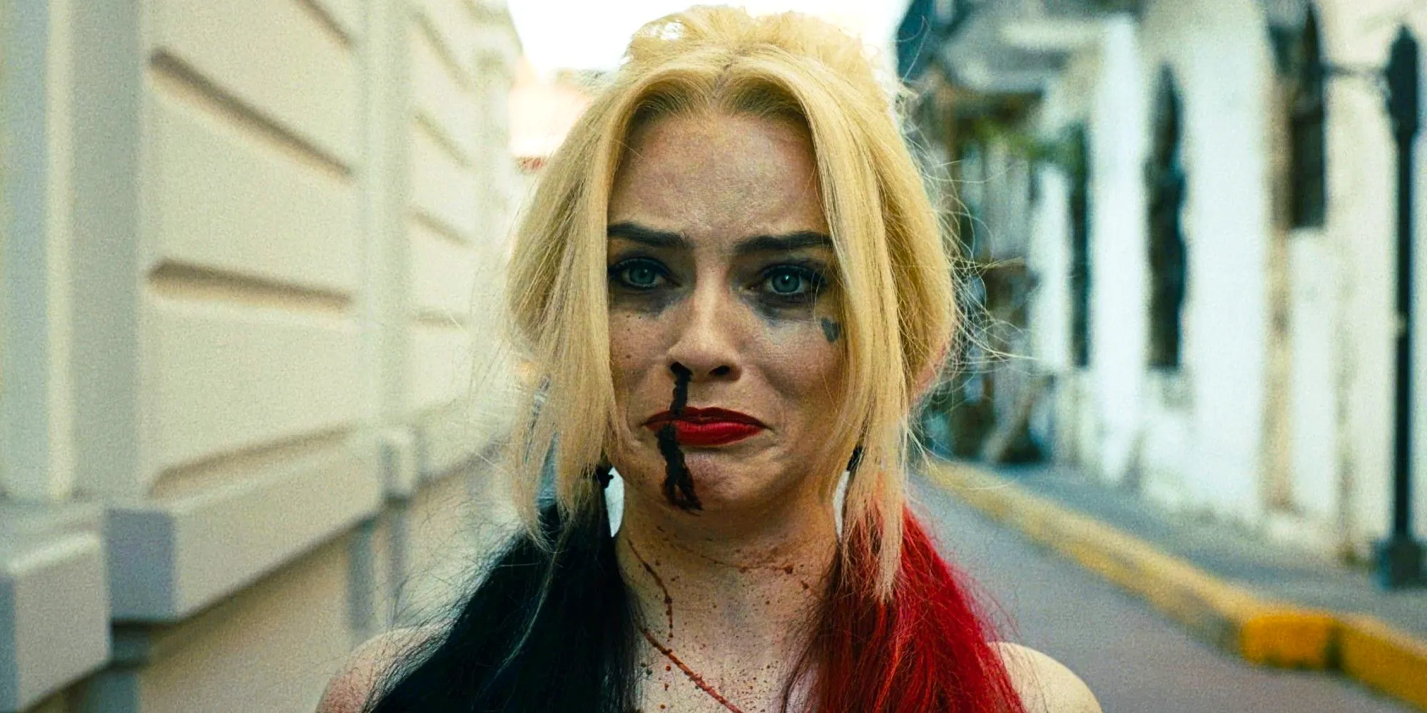 Margot Robbie as Harley Quinn in The Suicide Squad looking sad Image