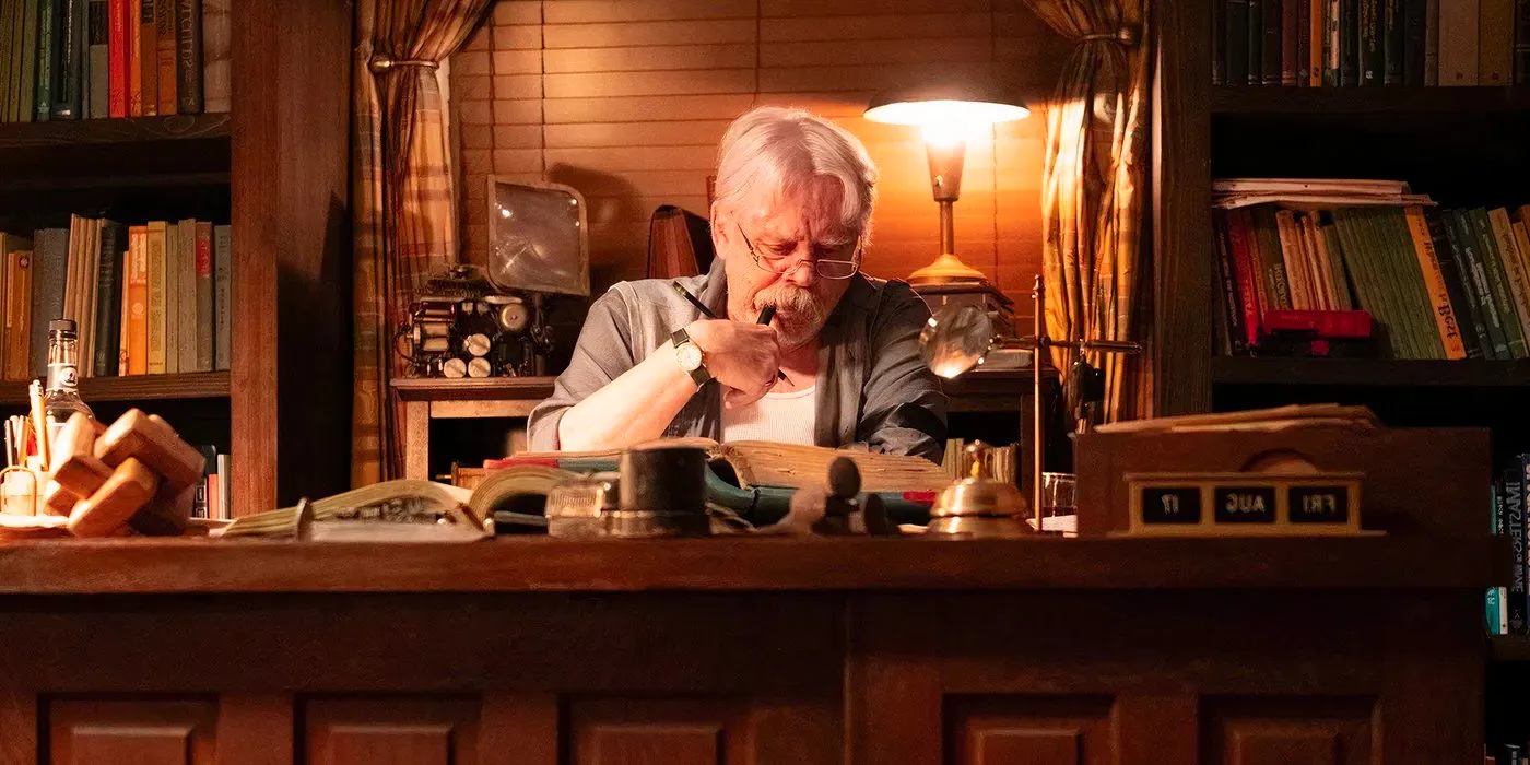 Mark Hamill Sitting At a Desk in The Life of Chuck Image