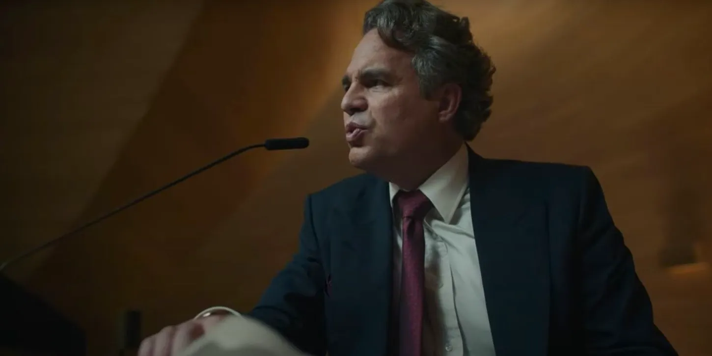 Mark Ruffalo speaking at a podium in Mickey 17 Image