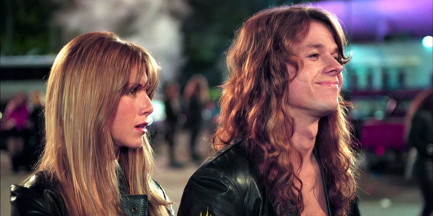 Mark Wahlberg and Jennifer Aniston standing next to each other in Rock Star Image