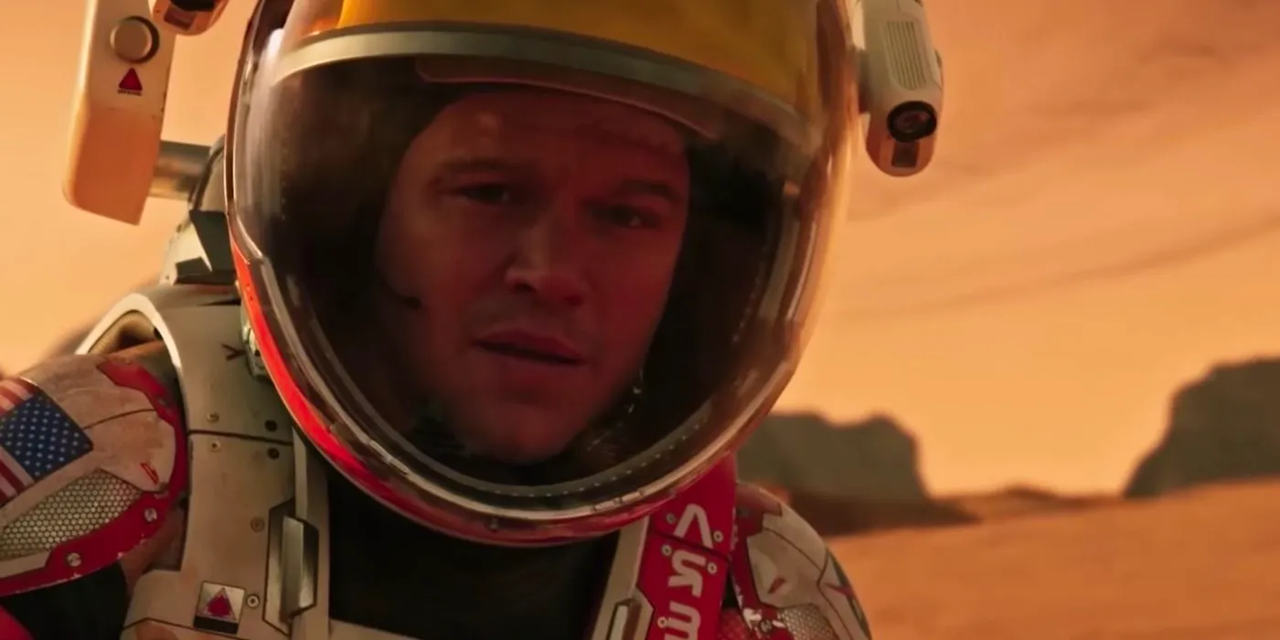 Mark Watney (Matt Damon) wearing a space suit and looking at the camera in The Martian. Image