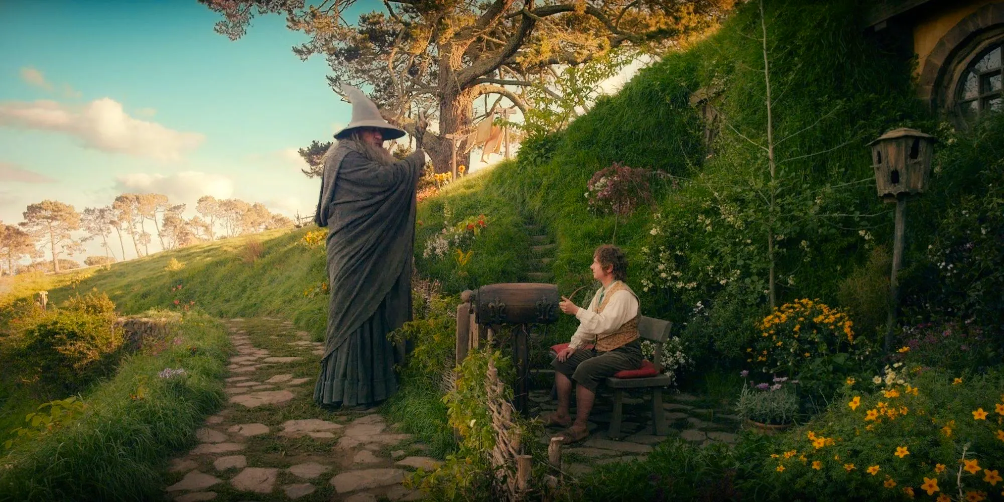 Martin Freeman as Bilbo Baggins and Ian McKellen as Gandalf in the Shire near Bilbo's Hobbit Hole Image