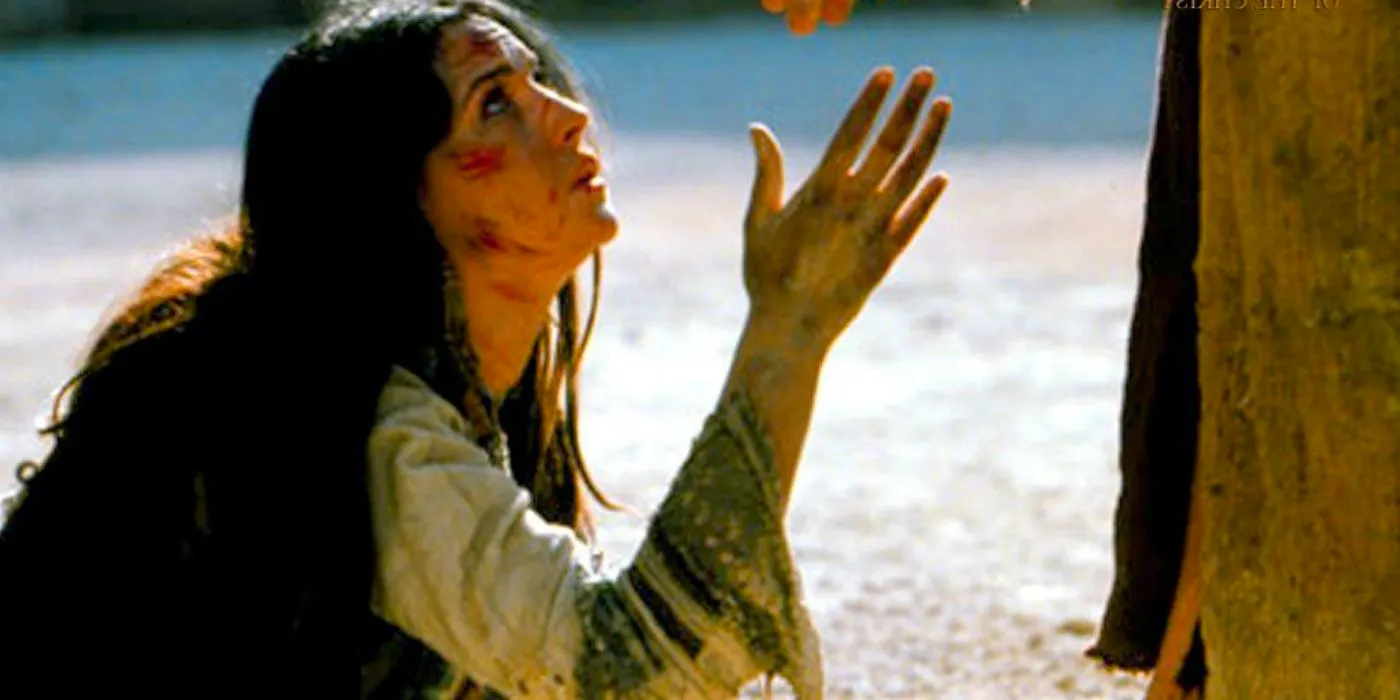 Mary begs at Jesus' feet in The Passion of the Christ Image