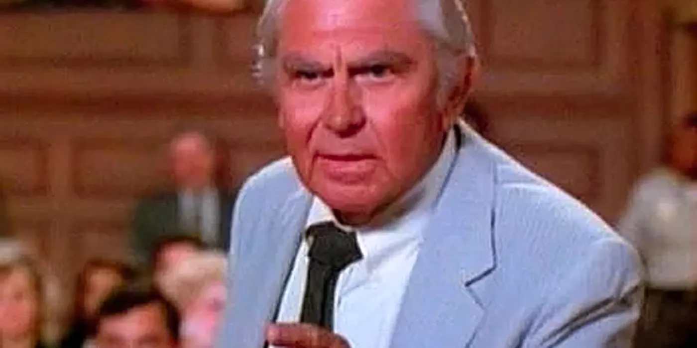 Matlock's Andy Griffith pointing at someone off camera in a courtroom Image