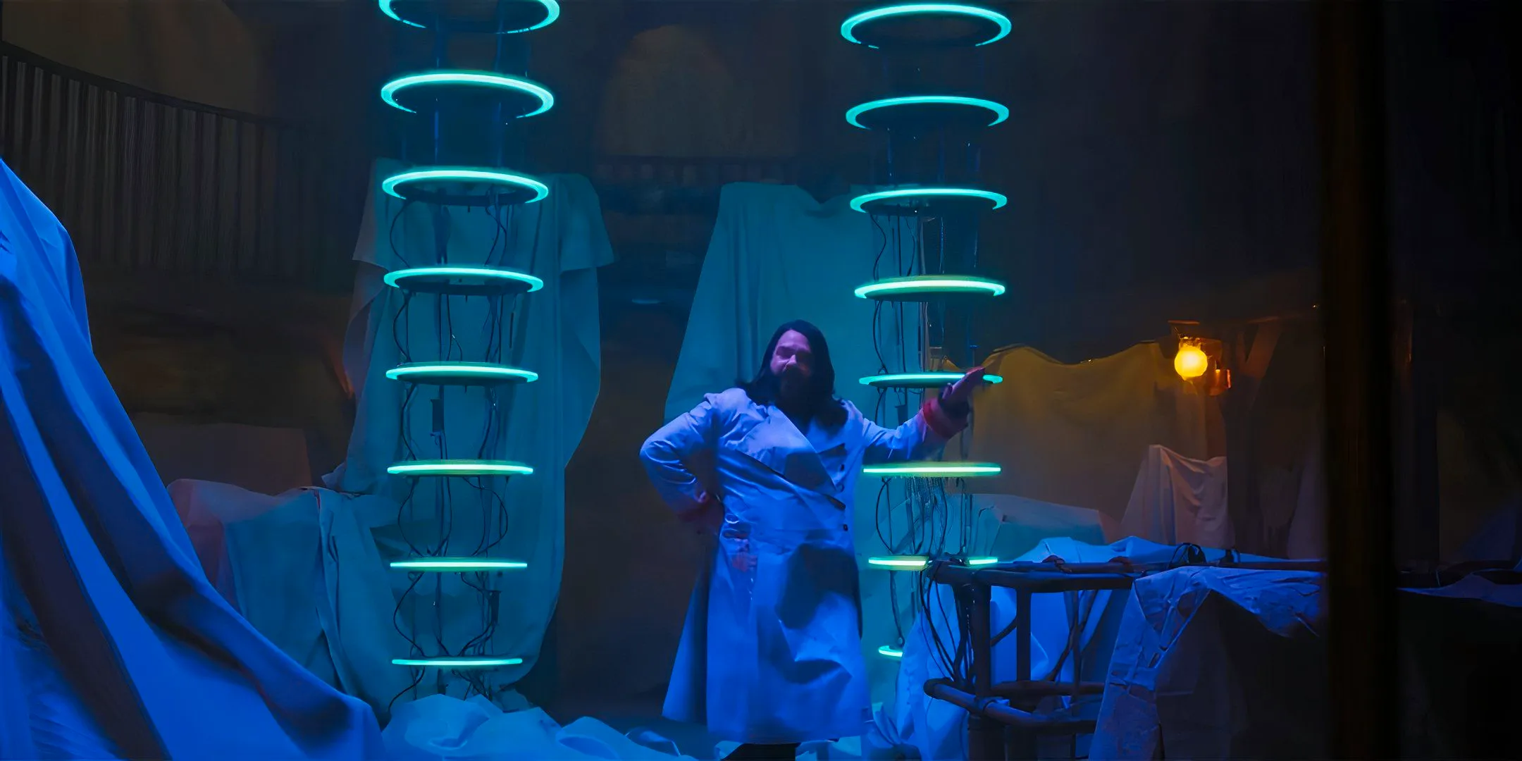 Matt Bery as Laszlo turning his scientific equipment back on in What We Do in the Shadows season 6 Image