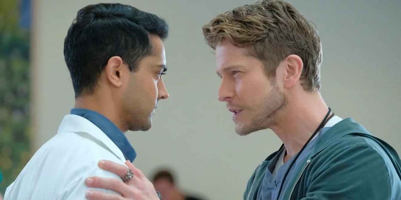 Matt Czuchry as Dr. Conrad Hawkins talking intensely to Dr. Pravesh in The Resident Image