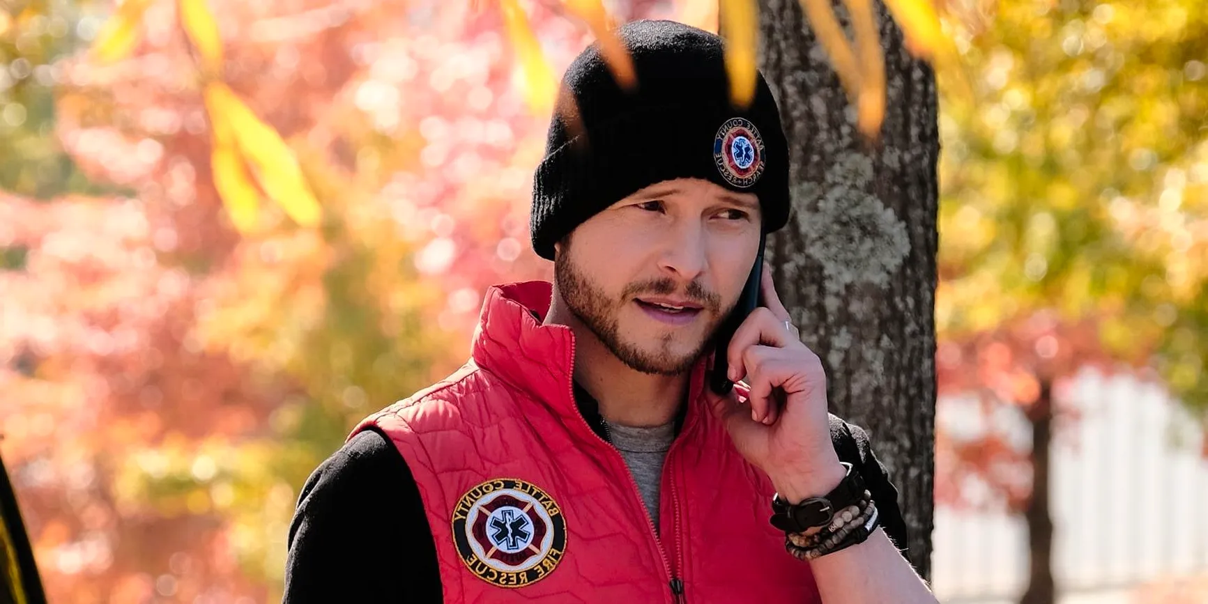 Matt Czuchry as Dr. Conrad Hawkins talking on the phone outside in The Resident Image