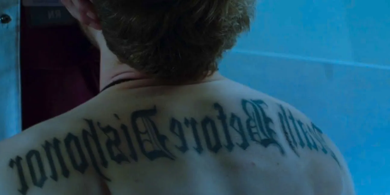 Matt Czuchry as Dr. Conrad Hawkins with a back tattoo reading 