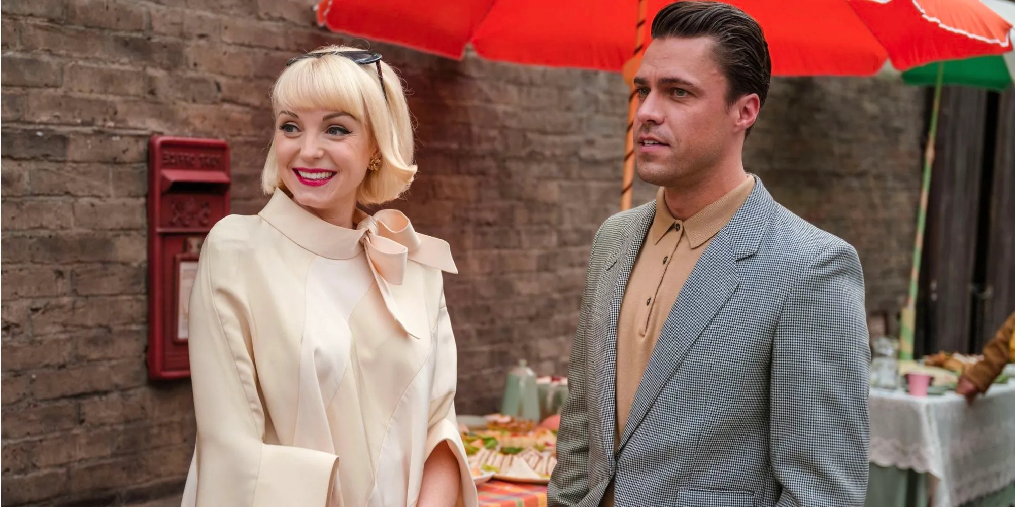 Matthew Aylward and Trixie Franklin standing at a cafe in Call the Midwife Image