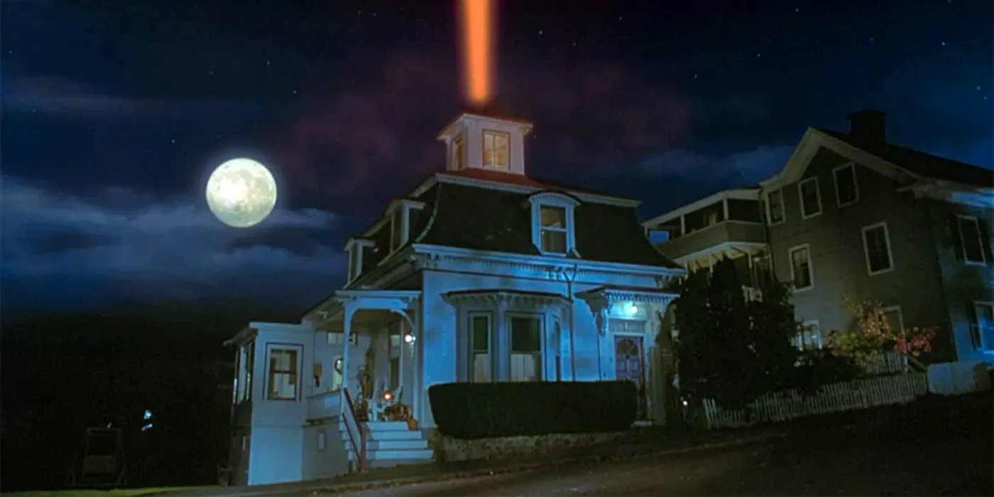 Max and Dani's house with a light coming out of it at night in Hocus Pocus. Image