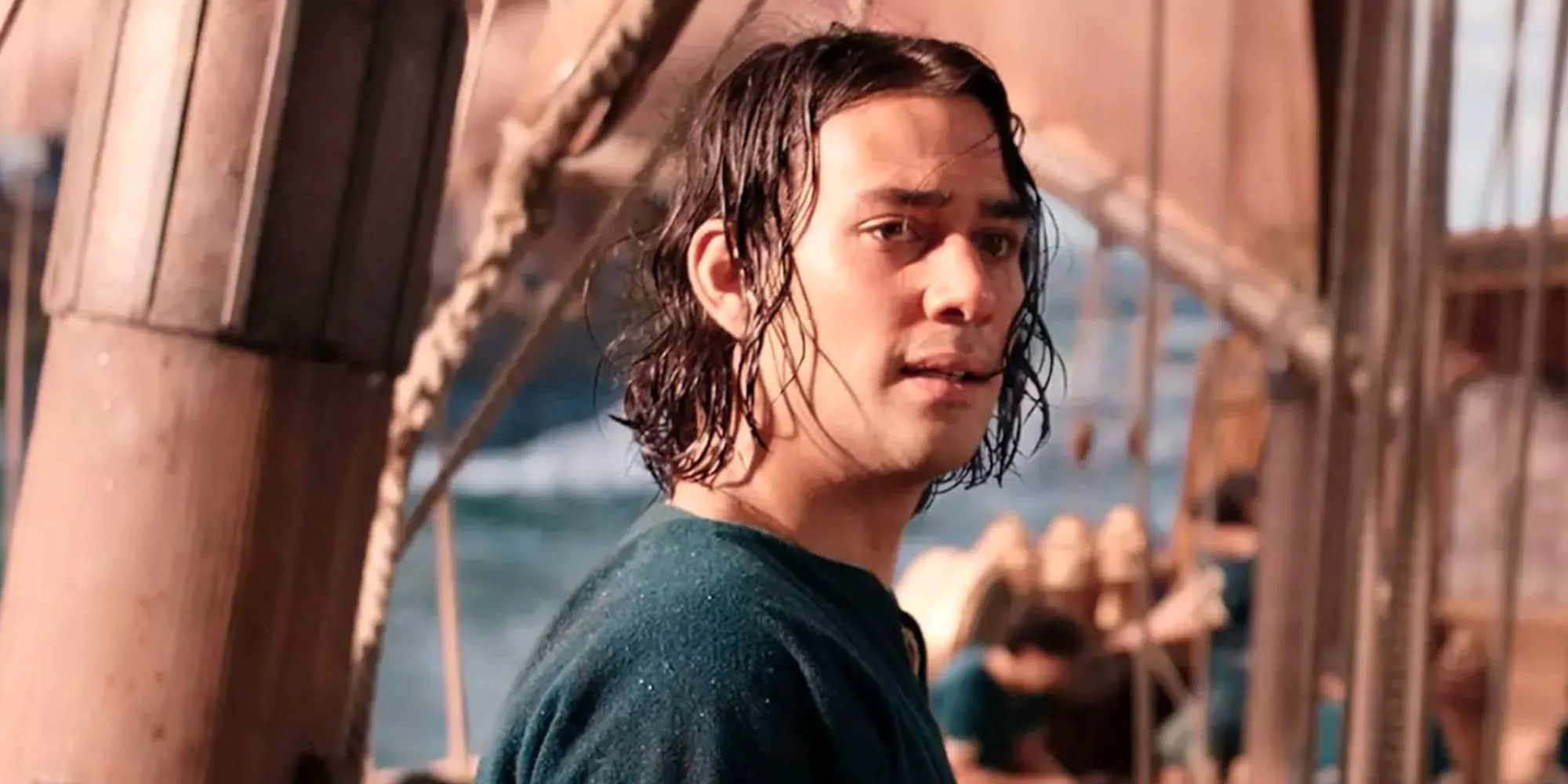 Maxim Baldry as Isildur looking into the distance while aboard a ship in Rings of Power Image