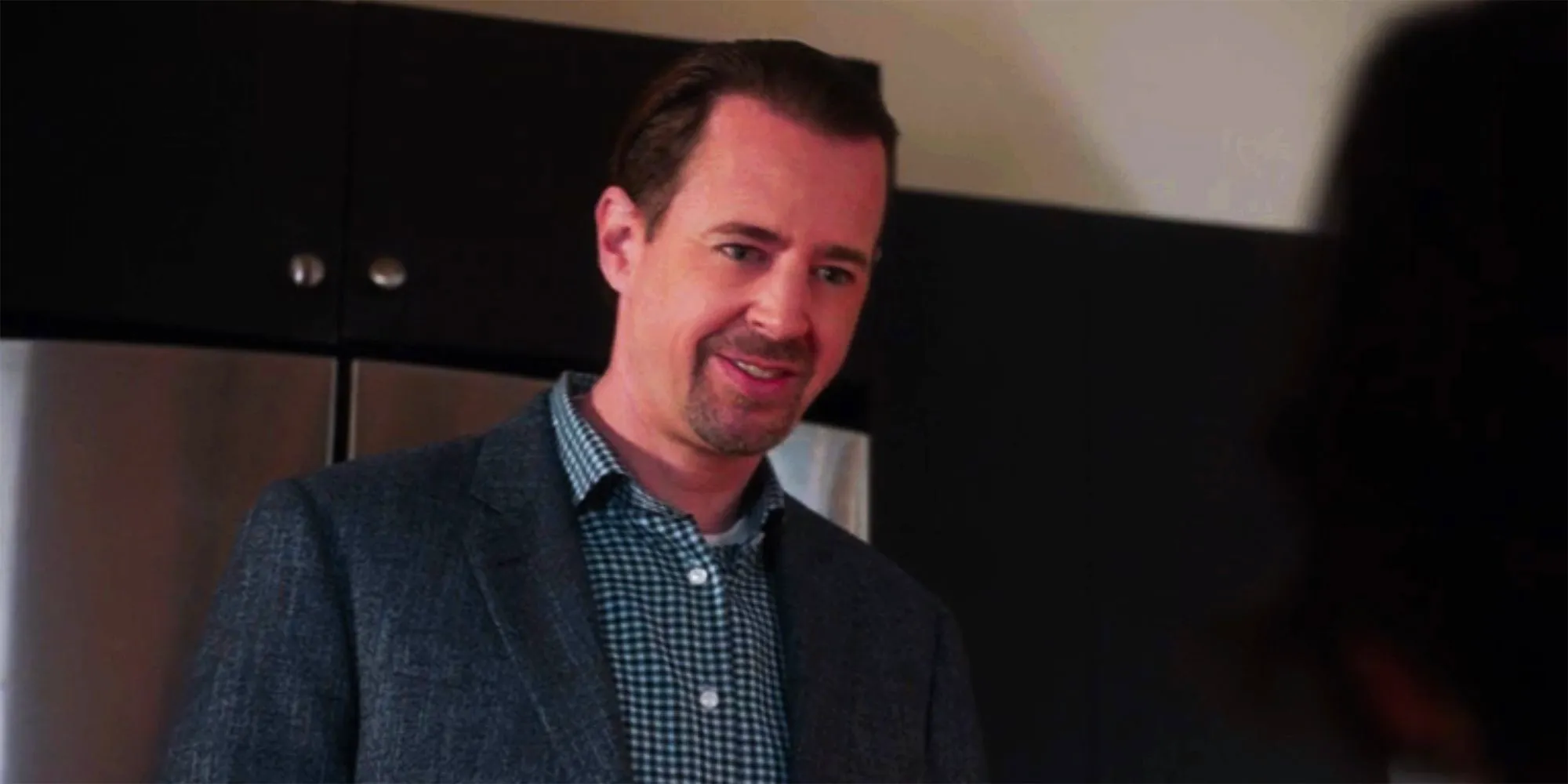 McGee looking confused in his kitchen talking to Delilah in NCIS Image