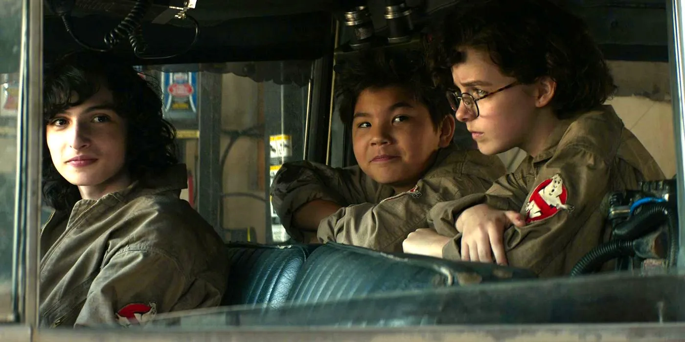 Mckenna Grace and Finn Wolfhard in the Ghostbusters car in Ghostbusters Afterlife Image