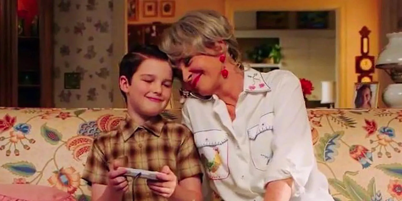 Meemaw and Sheldon hugging on her couch on Young Sheldon. Image