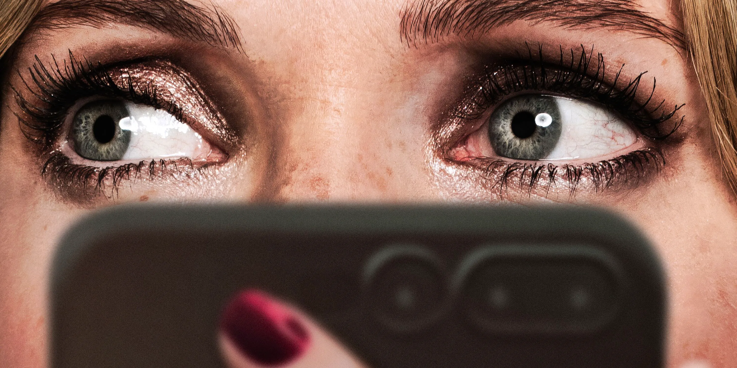 Meghann Fahy holding a phone in Drop poster Image