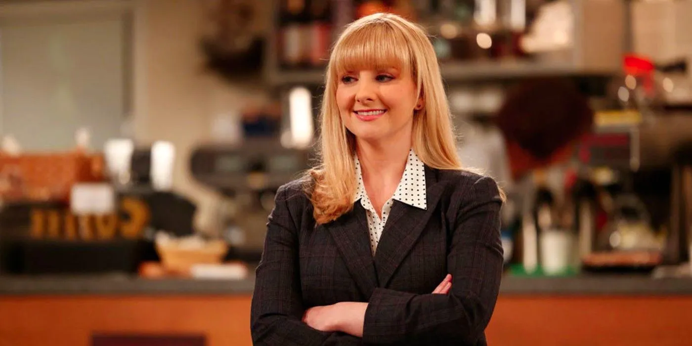 Melissa Rauch as Abby with her arms crossed while smiling in Night Court Image