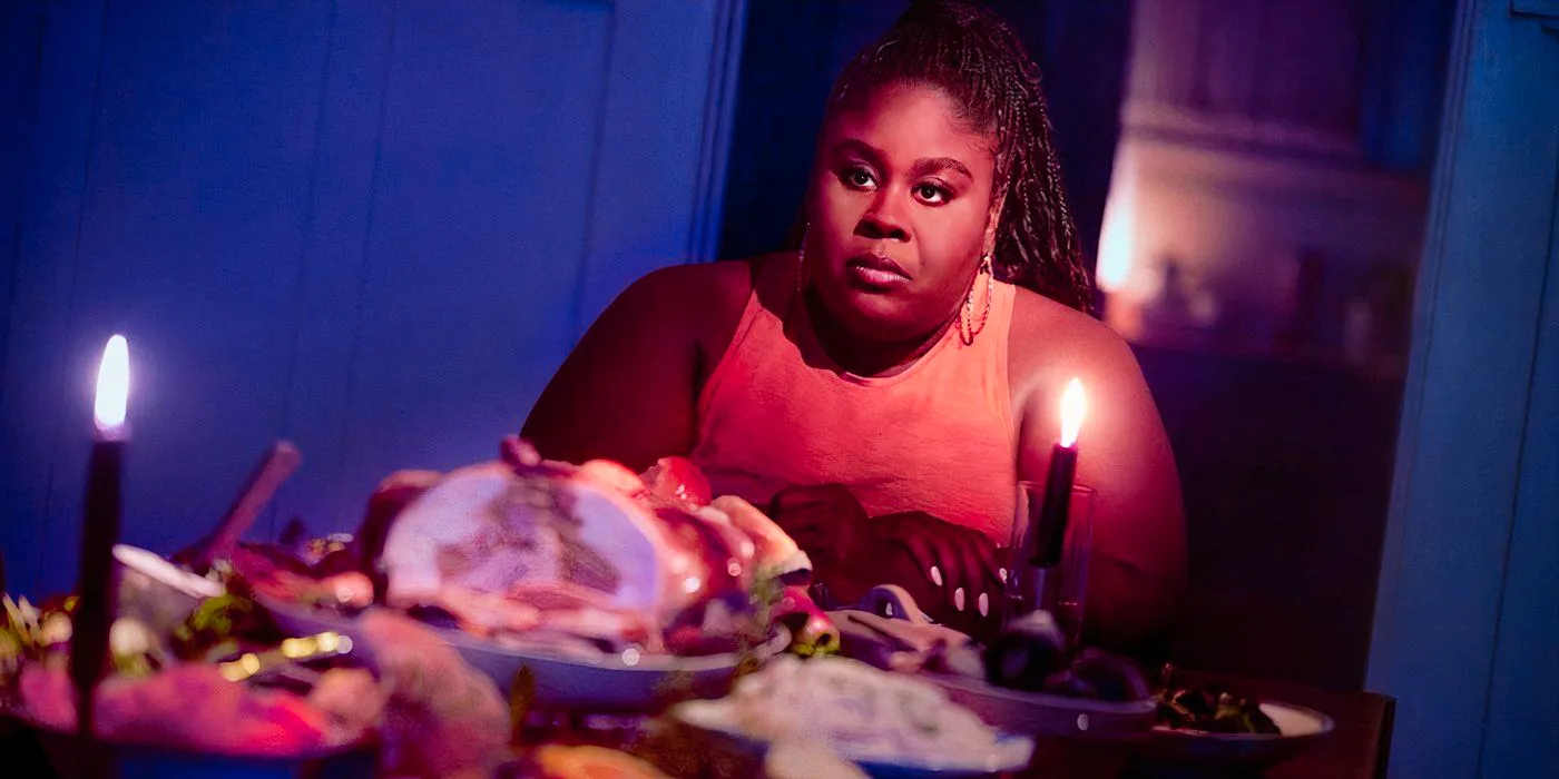 Merritt (Raven Goodwin) at a dining table in Grotesquerie Image