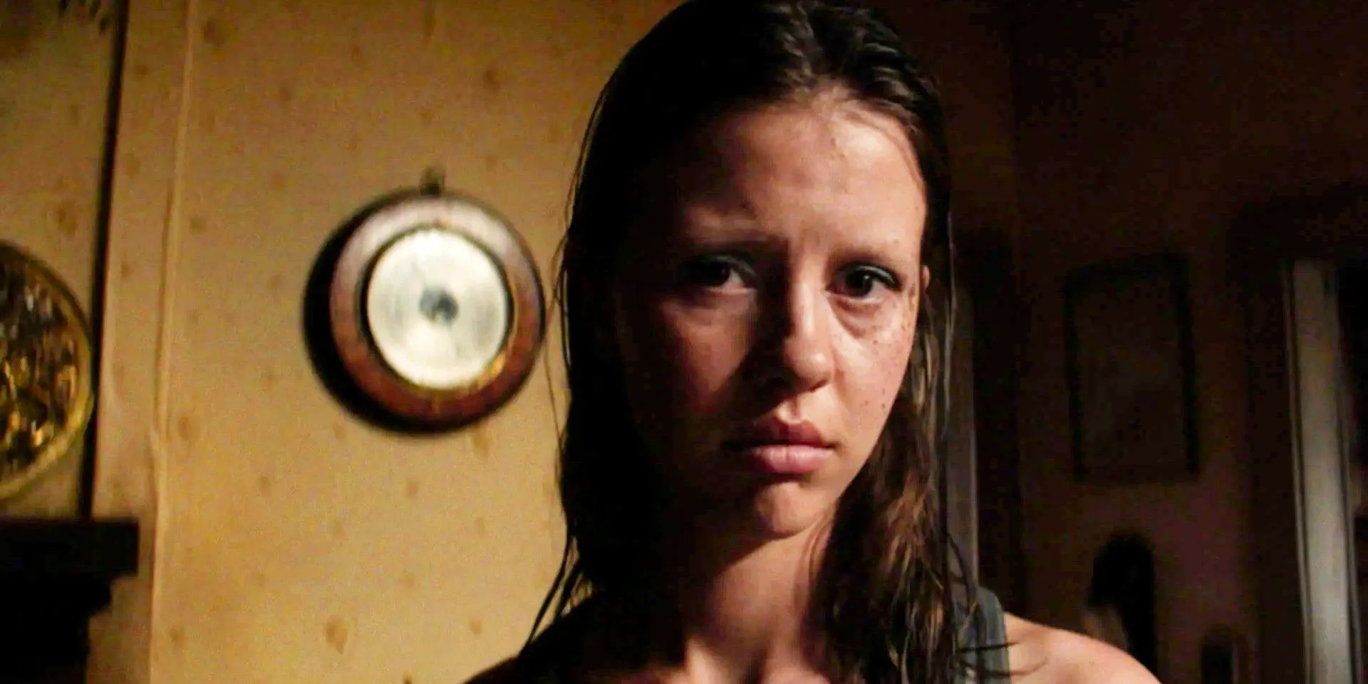 Mia Goth as Pearl/Maxine looking at the camera with a sad expression in X Image