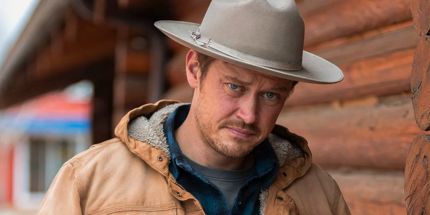 Michael Dorman as Joe Pickett standing outside a building Image