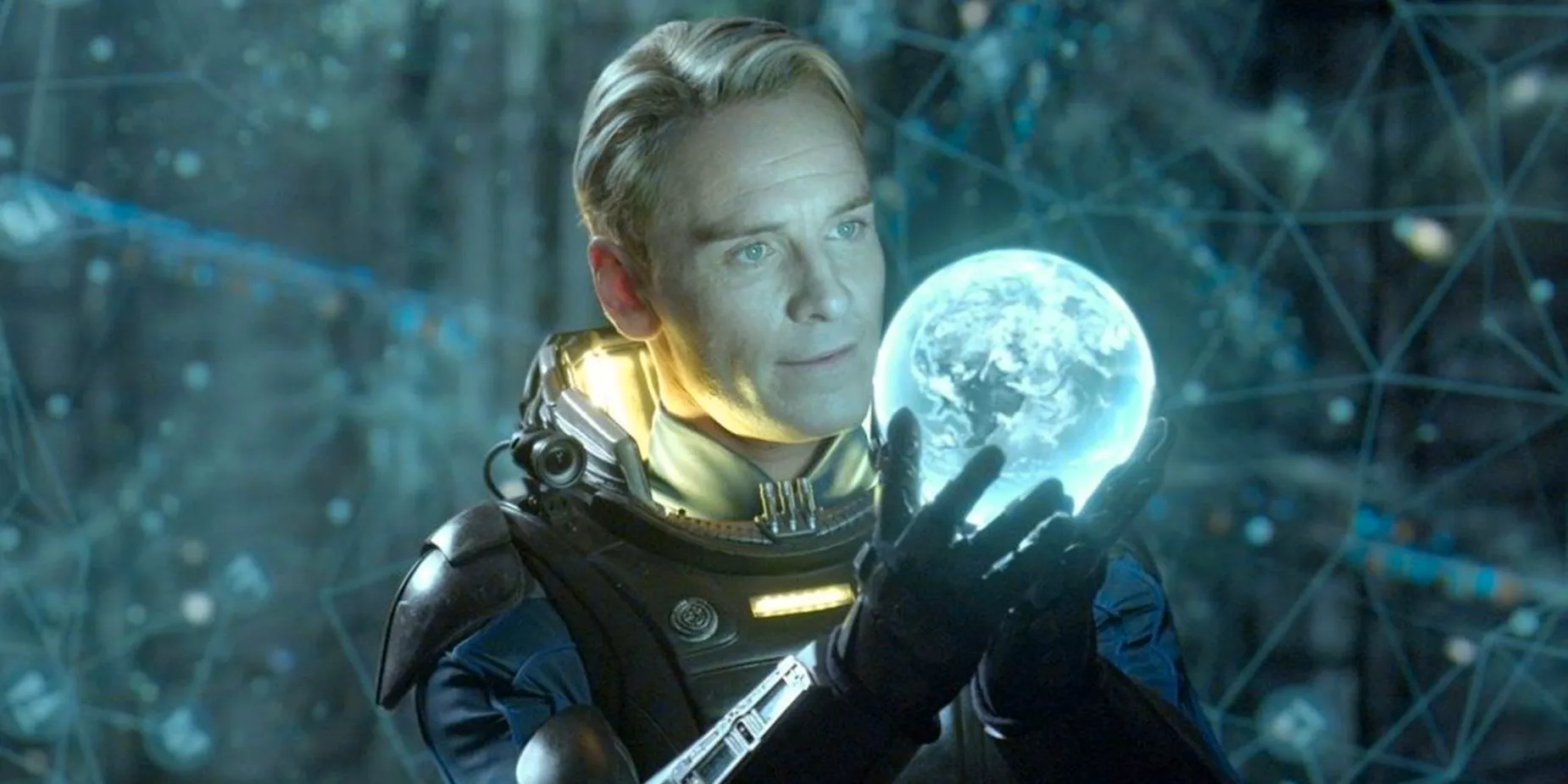 Michael Fassbender as David holding a small holographic planet in Prometheus. Image