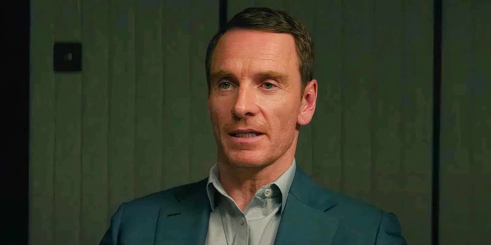 Michael Fassbender being interrogated in The Agency Image