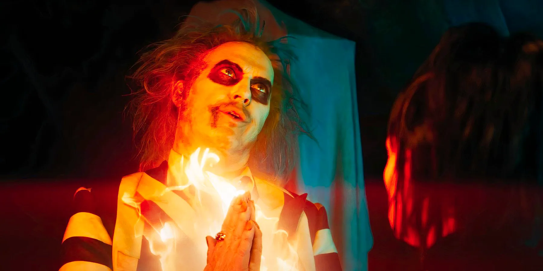 Michael Keaton on fire as Beetlejuice in Beetlejuice Beetlejuice Image