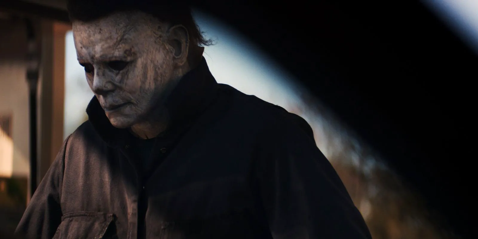 Michael Myers looking off-screen in Halloween 2018 Image