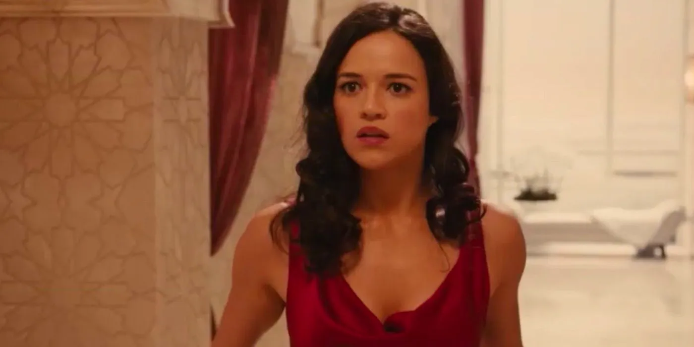 Michelle Rodriguez looking scared in Furious 7 Image