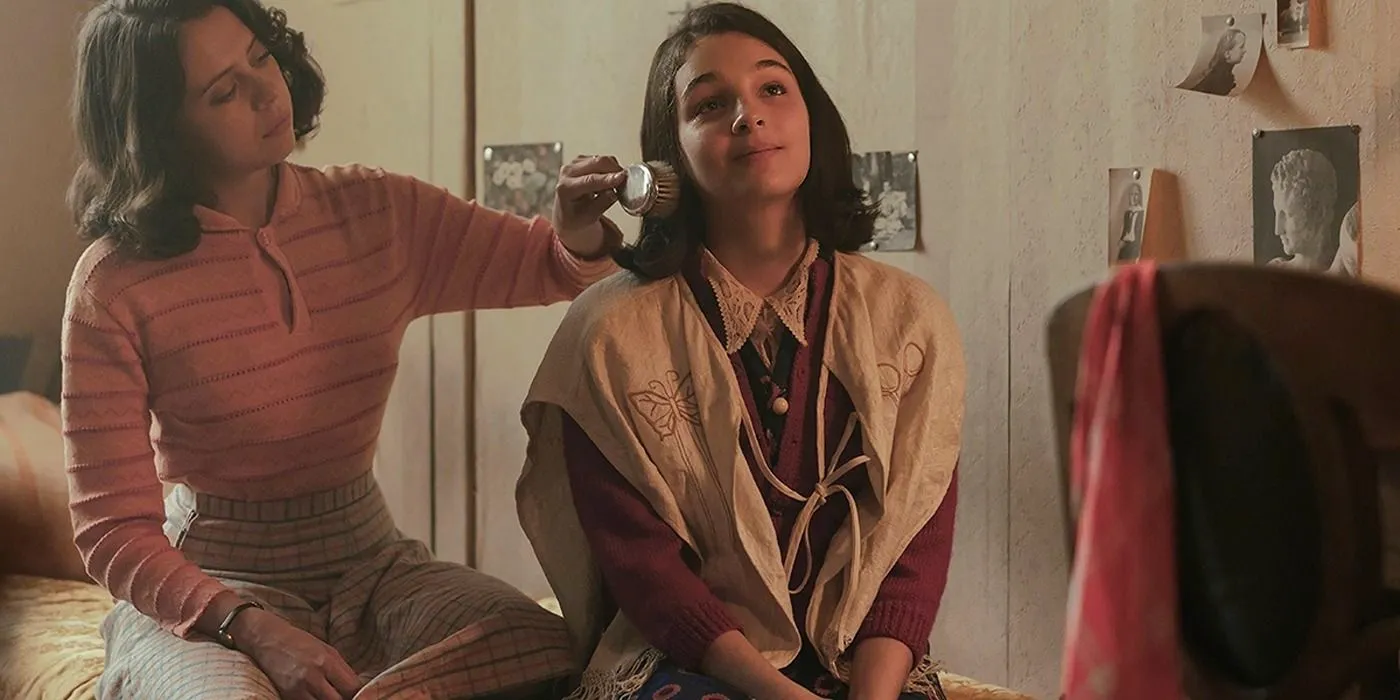 Miep Gies (Bel Powley) brushes Anne's (Billie Boullet) hair in A Small Light  Image