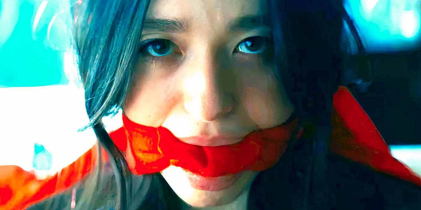 Mikey Madison with a red gag over her mouth in Anora.jpg Image