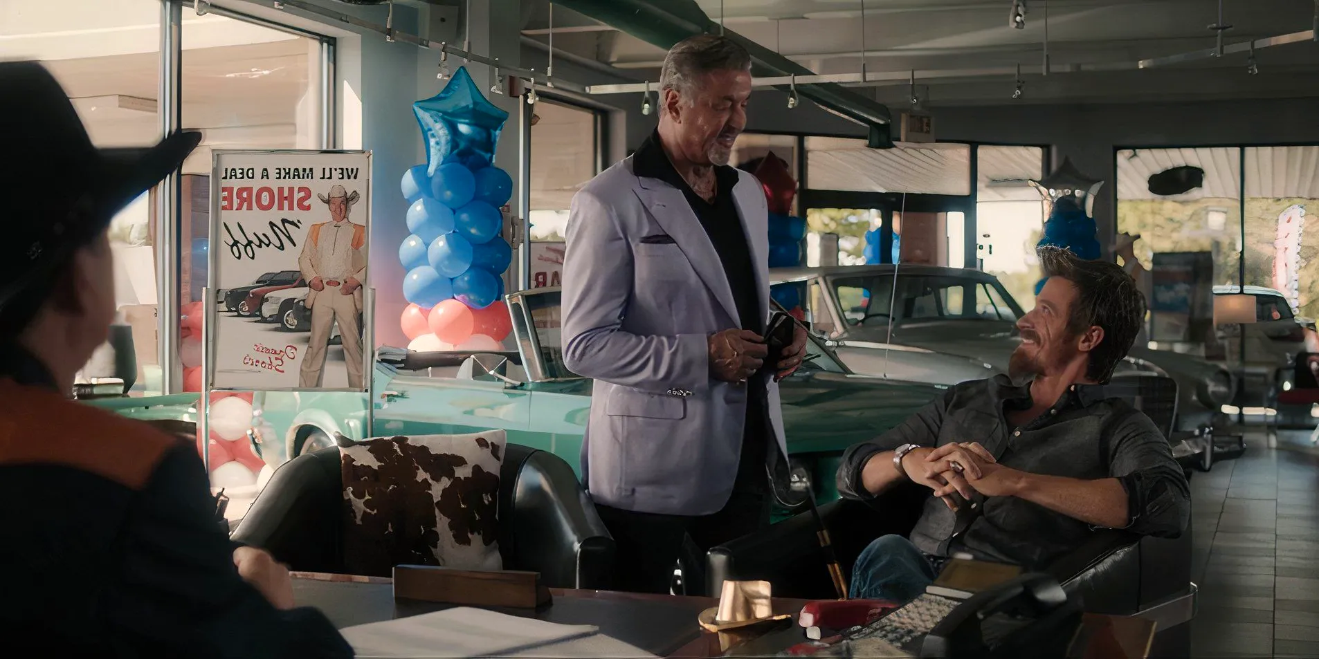 Mitch Keller (Garrett Hedlund) and Dwight Manfredi (Sylvester Stallone) at Donnie's car dealership in Tulsa King season 2, episode 4 Image