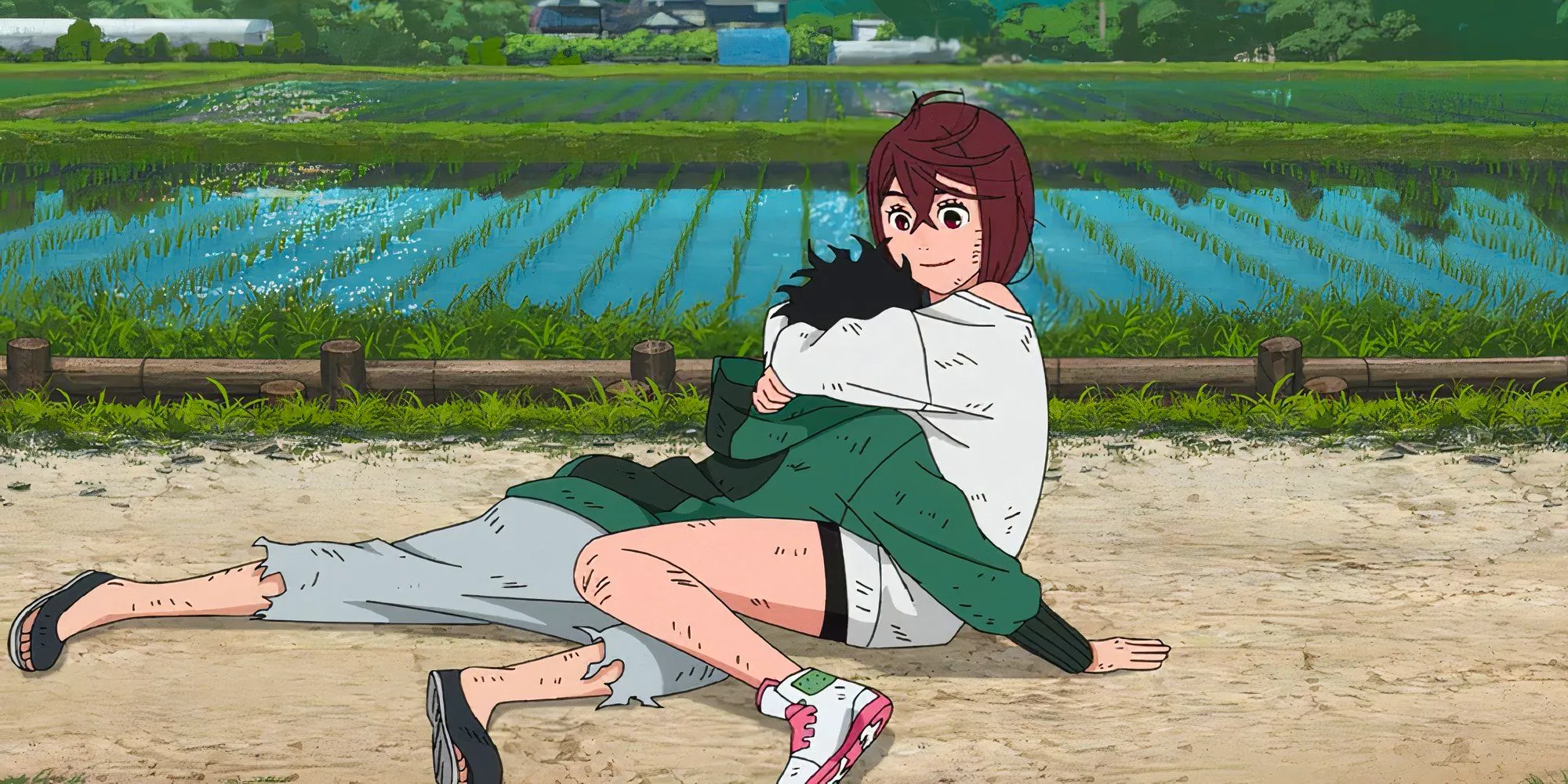 Momo holding Okarun's head on her chest Image