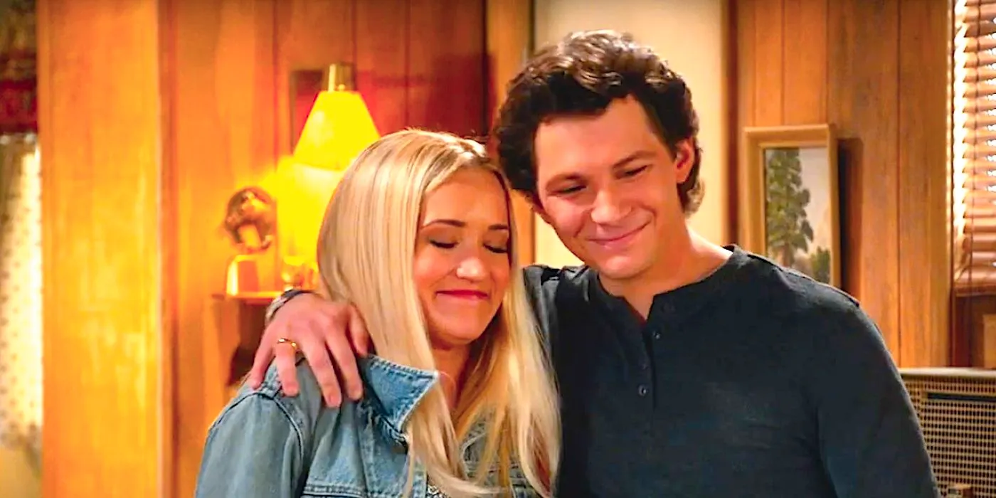 Montana Jordan's Georgie and Emily Osment's Mandy embrace and smile in Georgie & Mandy's First Marriage trailer Image