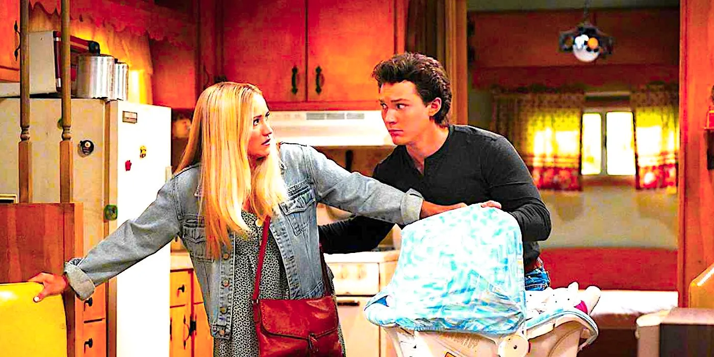 Montana Jordan's Georgie and Emily Osment's Mandy looking worried while holding a baby basket in a kitchen from Georgie & Mandy's First Marriage Image