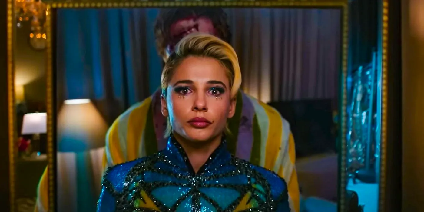 Naomi Scott as Skye looking scared in a mirror as Lewis' ghost stands behind her in Smile 2 Image