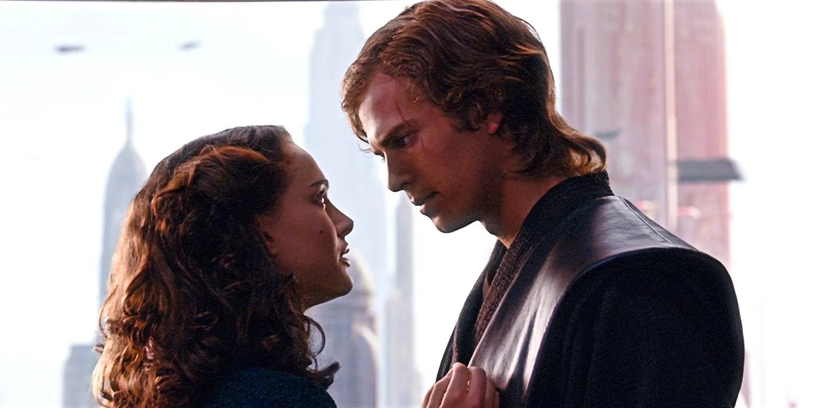 Natalie Portman as Padme and Hayden Christensen as Anakin Skywalker in Revenge of the Sith stare at one another. Image