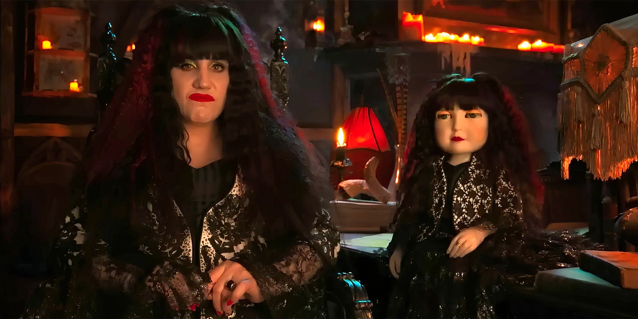 Natasia Demetriou as Nadja looking disinterested while sitting next to her doll in What We Do in the Shadows season 6 Image