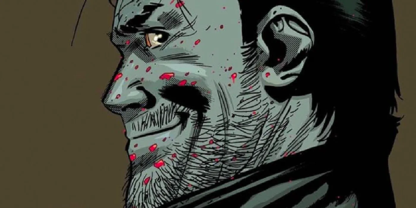 Negan in black-and-white with red blood splattered on his face, smiling sinisterly. Image