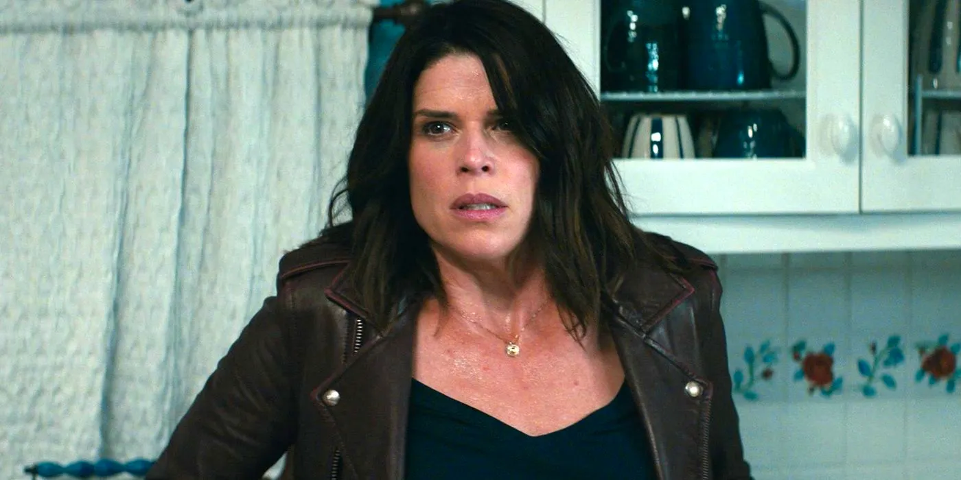 Neve Campbell as Sidney Prescott wearing a brown jacket in Scream 2022 Image