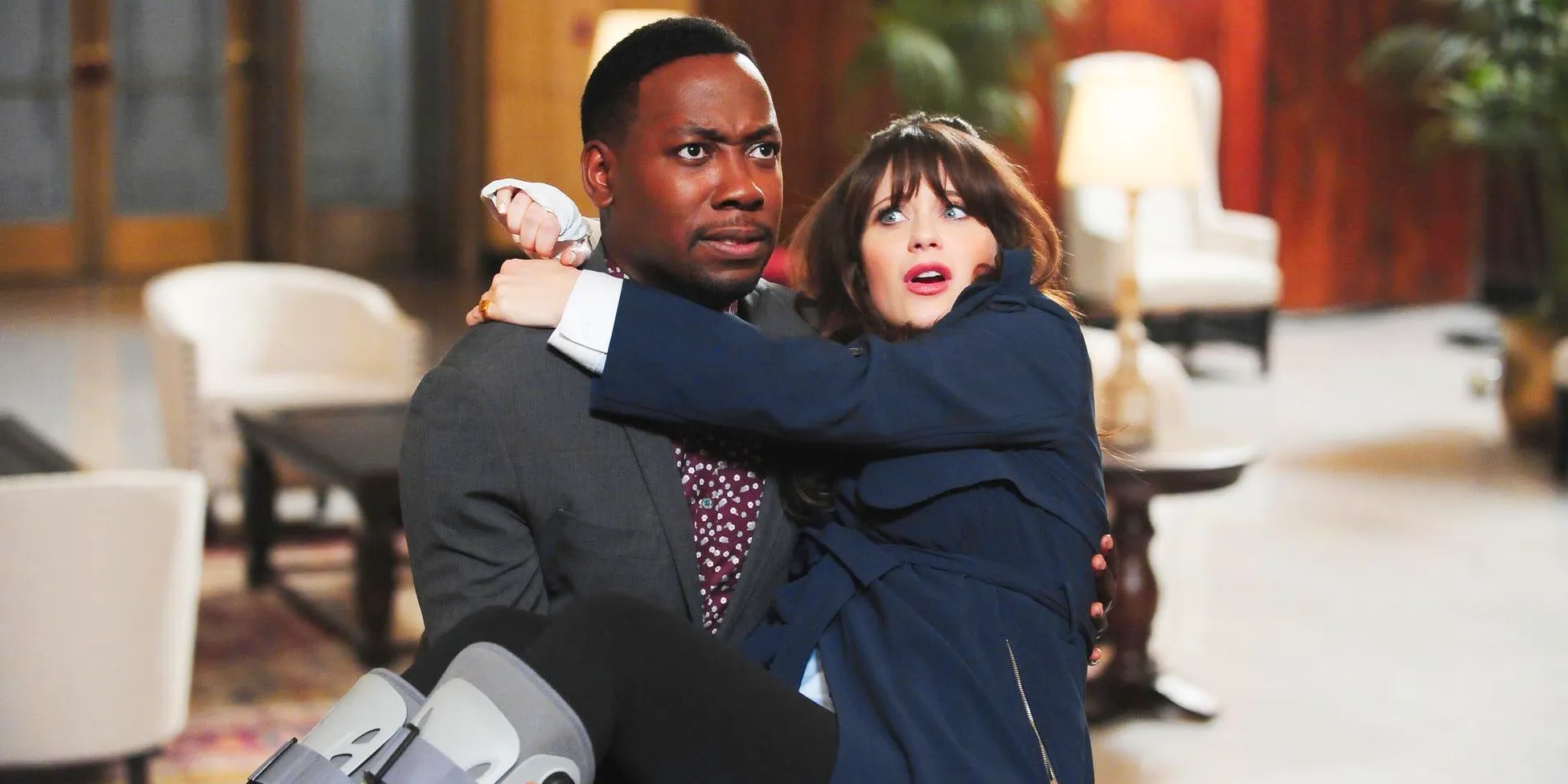 New Girl Winston carrying a worried Jess Image