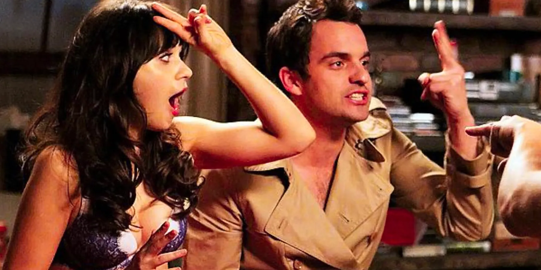 Nick angrily holding his fingers up while Jess is shocked with two fingers on her forehead during the second season True American game in New Girl Image