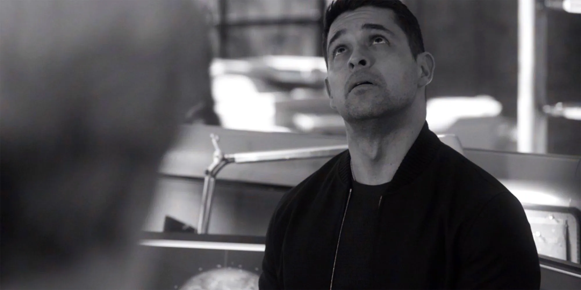 Nick Torres in a paused black and white image in NCIS season 21 Image