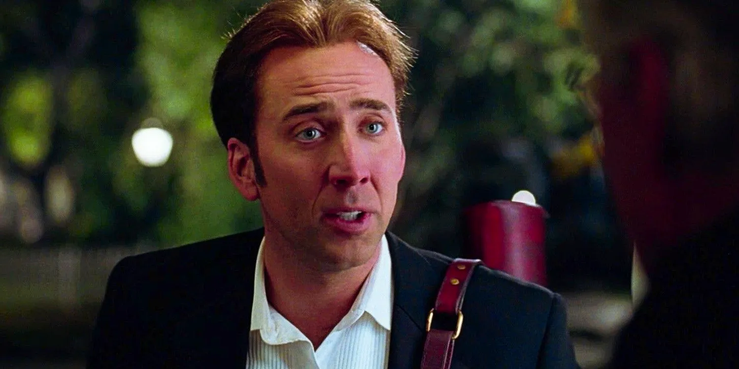 Nicolas Cage as Ben Gates talking to his dad with the Declaration of Independence slung over his shoulder in National Treasure Image