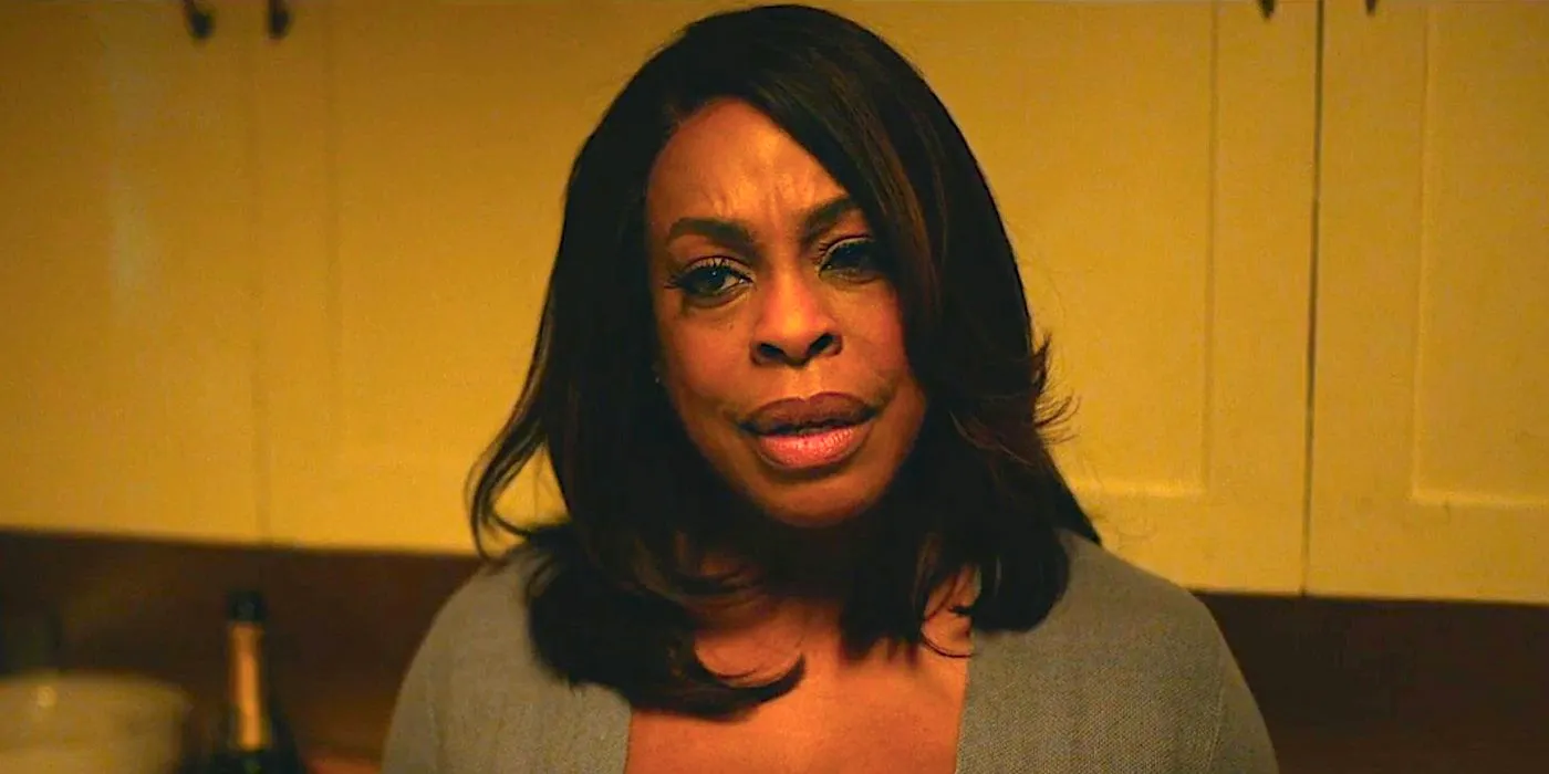 Niecy Nash-Betts' Lois looking angry in her kitchen in Grotesquerie episode 7 Image