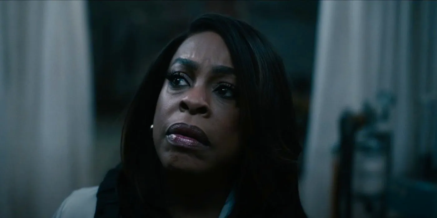 Niecy Nash's Lois looking worried in Grotesquerie Image