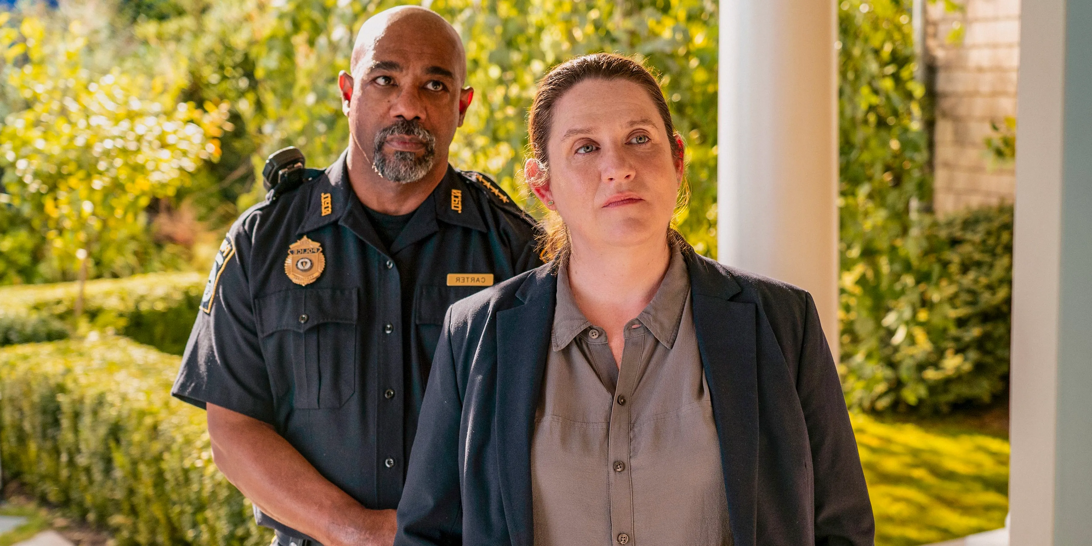 Nikki Henry (Donna Lynne Champlin) and Dan Carter (Michael Beach) conducting a police investigation in The Perfect Couple Image