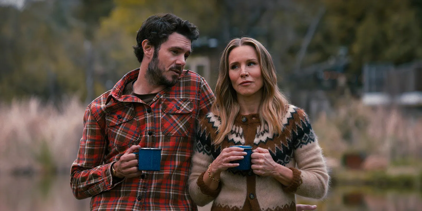 Noah and Joanne hold coffee mugs while talking in Nobody Wants This Image