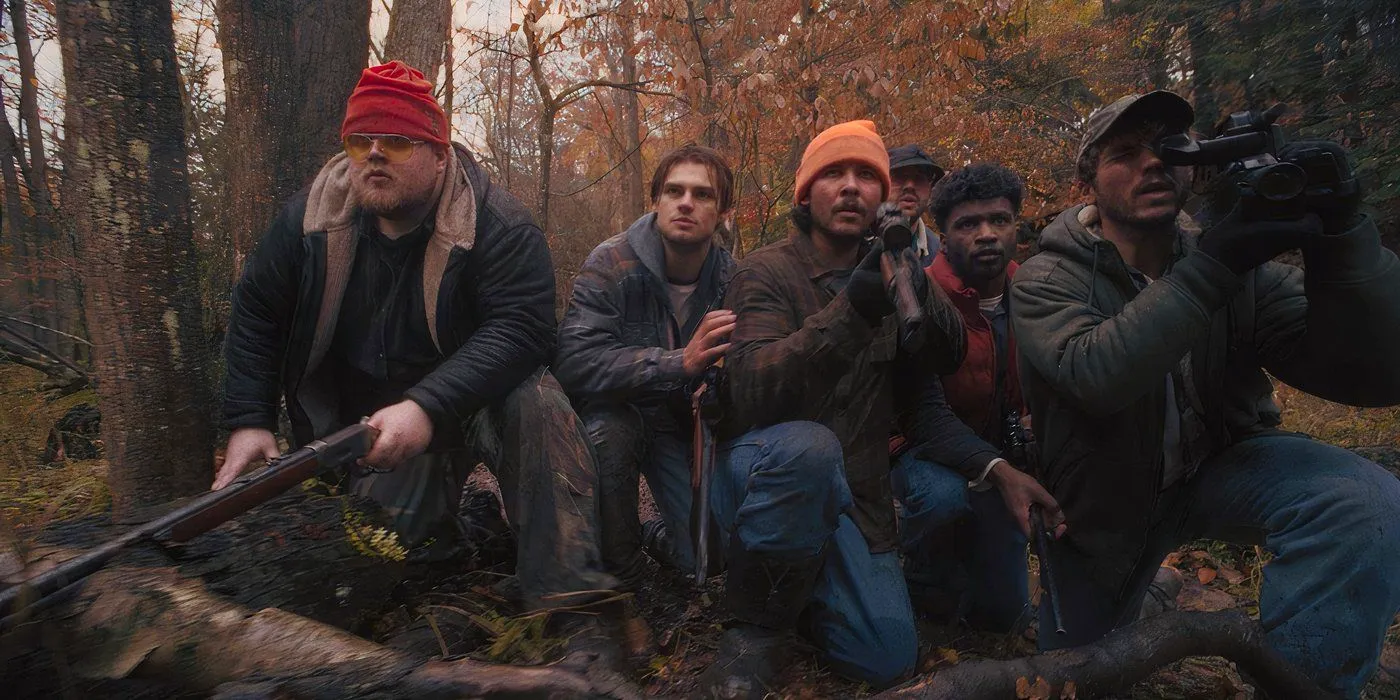 Noah LoLande and the rest of the cast of 2022 horror movie Deer Camp '86 Image