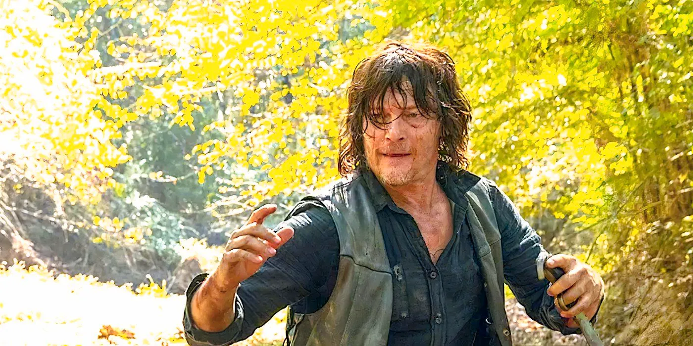 Norman Reedus's Daryl Dixon holding a knife in the woods in The Walking Dead season 10 Image